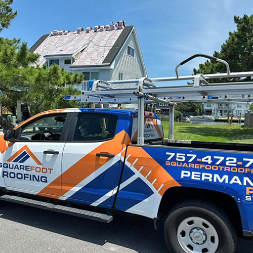 Roofing company truck with ladder