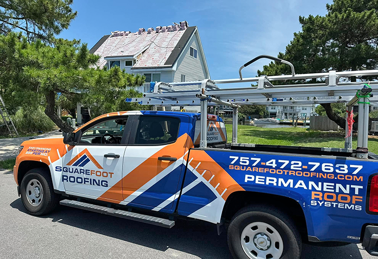 Roofing company truck with ladder